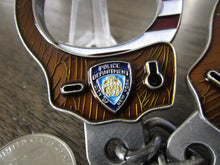 Load image into Gallery viewer, NYPD American Flag Handcuffs With Eagle Key Brown Wood Version Challenge Coin
